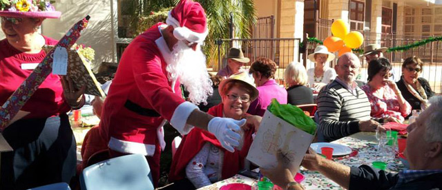 Guests, residents, family enjoy Christmas in July at Elements.